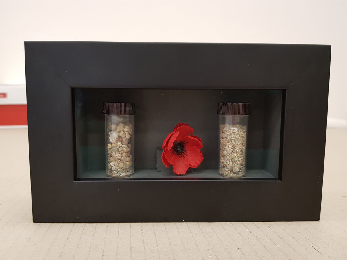 Objects and flowers in box frame Shadow box framing mementos