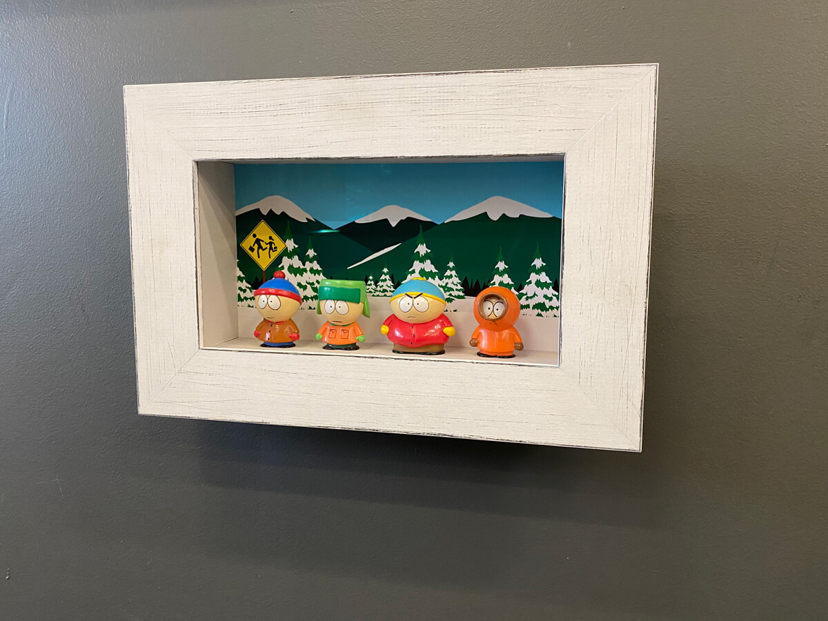 Framed southpark figurines